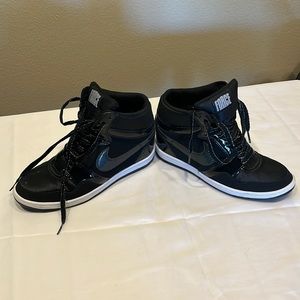 Size 12 Woman’s NIKE FORCE HEEL SNEAKER.